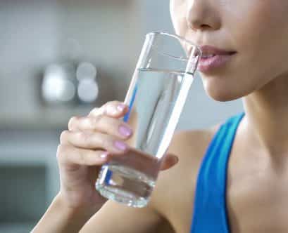 Sports girl drinking crystal clear water, restoring aqua balance after training, stock footage